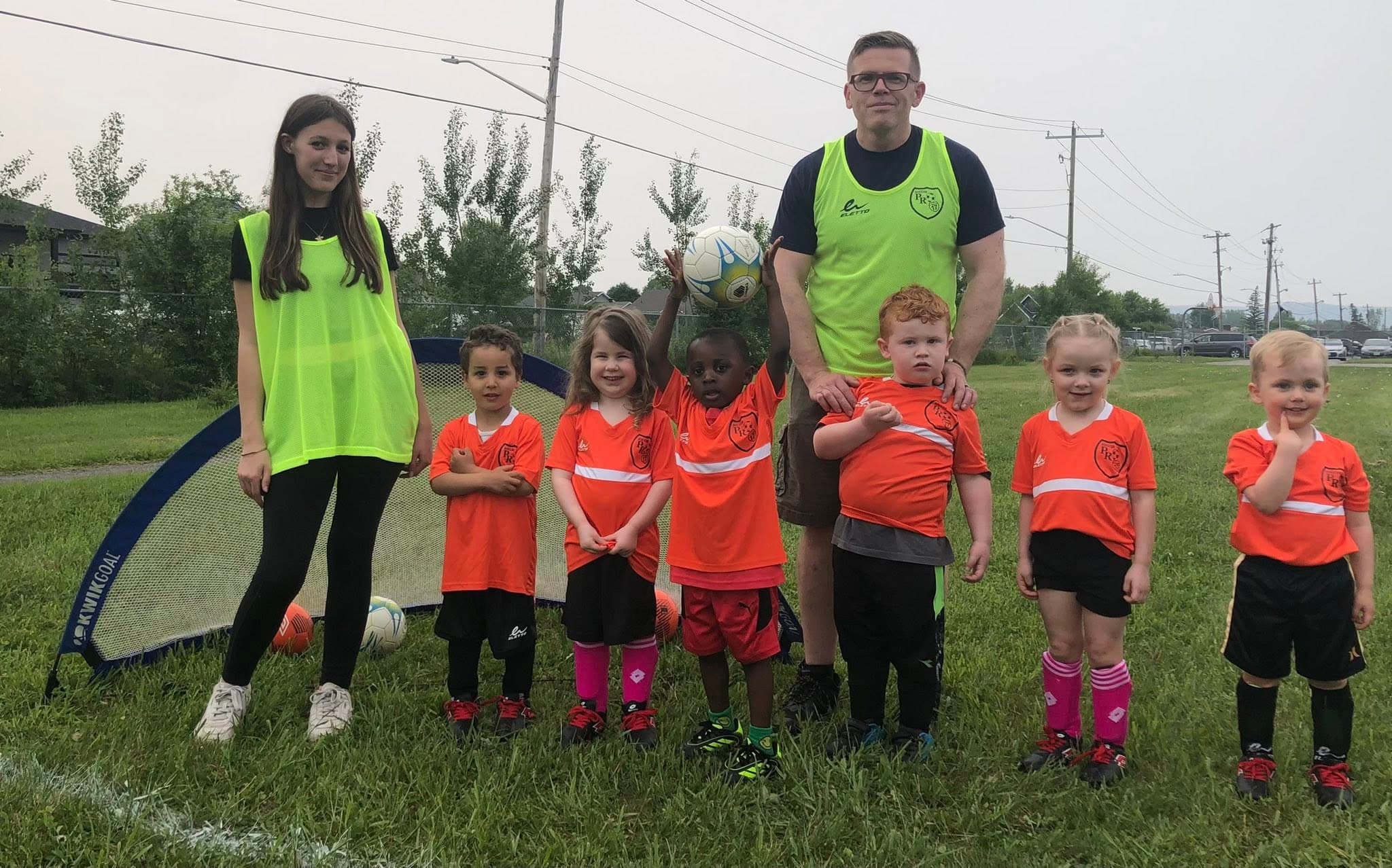 Soccer toddlers with coaches